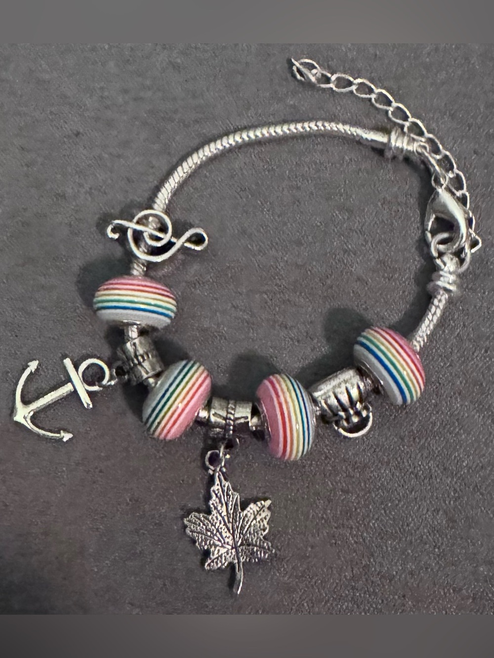 Silver Tone Bracelet with Pink Multi-Stripe Beads and Leaf and Anchor Charms